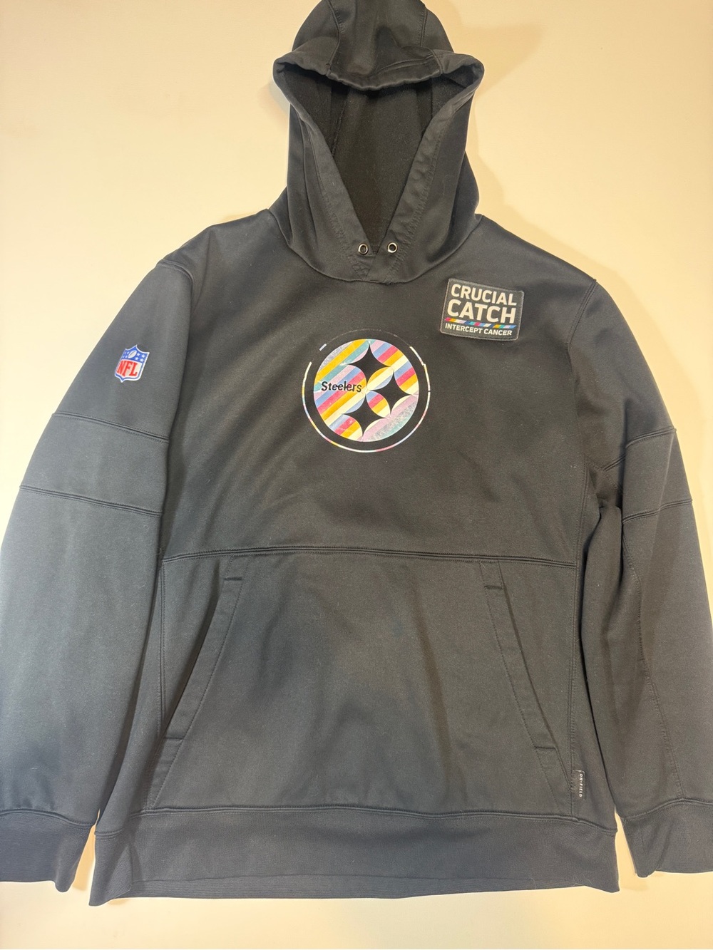 Crucial Catch Black Pullover with Multicolor Stripe Patch